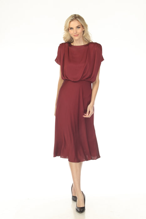 Woman wearing a red satin midi A-line dress with blouson bodice from Joseph Ribkoff