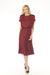 Woman wearing a red satin midi A-line dress with blouson bodice from Joseph Ribkoff