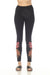 Woman wearing a black legging with palm tree embroidery from Johnny Was
