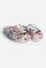 A pair of platform slide sandals with a vibrant multicolor floral print on a white base, shown against a plain light gray background.