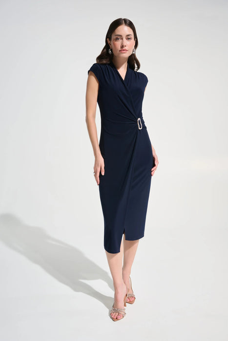 Woman wearing a rhinestone wrap sheath midi dress featuring a flattering silhouette and elegant waist detail