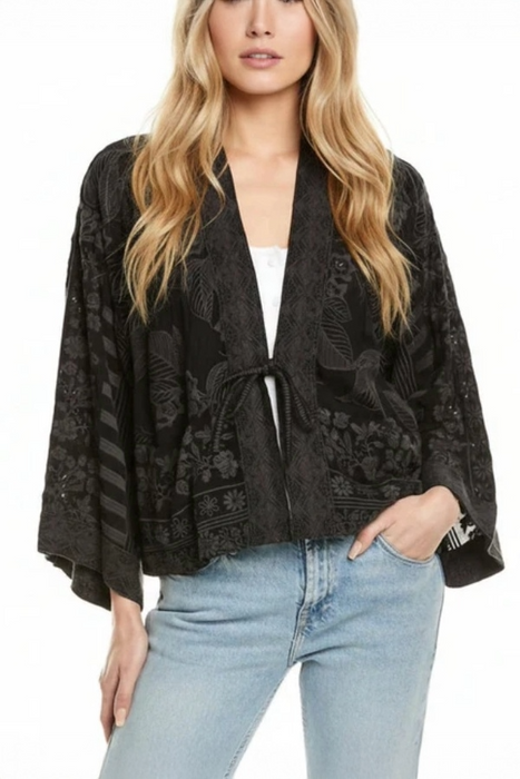 Woman wearing a black embroidered kimono with front tie from Johnny Was