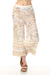 Woman wearing vintage atlas printed wide leg pants with cropped length from Charlie B