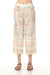 Woman wearing vintage atlas printed wide leg pants with cropped length from Charlie B