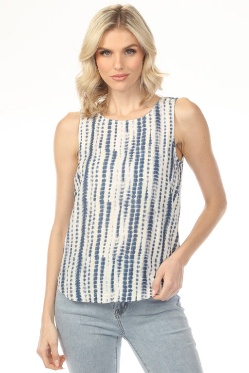 Woman wearing a sleeveless blue and white patterned top with rounded hem from Charlie B