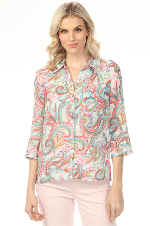 Woman wearing a colorful paisley patterned blouse with button front and roll up sleeves from Charlie B