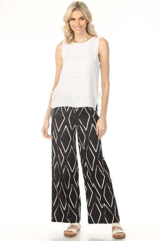 Woman wearing black wide-leg pants with white diamond pattern from Charlie B
