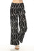 Black wide-leg pants with white diamond pattern from Charlie B
