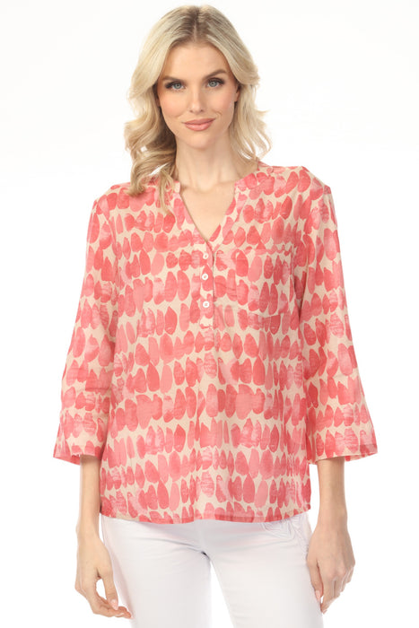 Woman wearing a patterned v-neck henley blouse with 3/4 sleeves and chest pocket from Charlie B