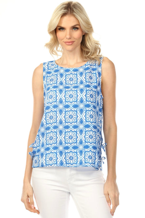 Woman wearing a blue patterned sleeveless top with side ties from Charlie B