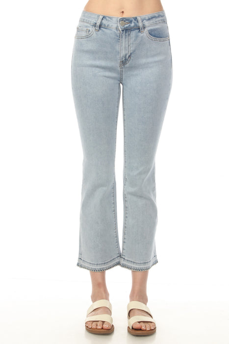 Woman wearing light blue cropped flare leg jeans with button and zip closure from Charlie B