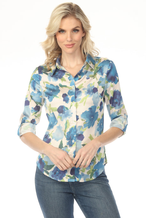 Woman wearing a floral blouse with button-up front and roll-up sleeves from Charlie B