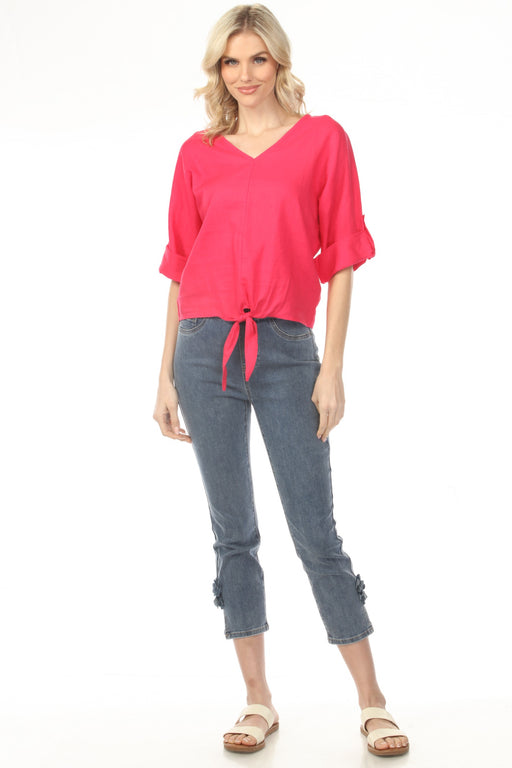 Woman wearing a slim cropped jeans with pull on waist and side slit with rose detail from Charlie B