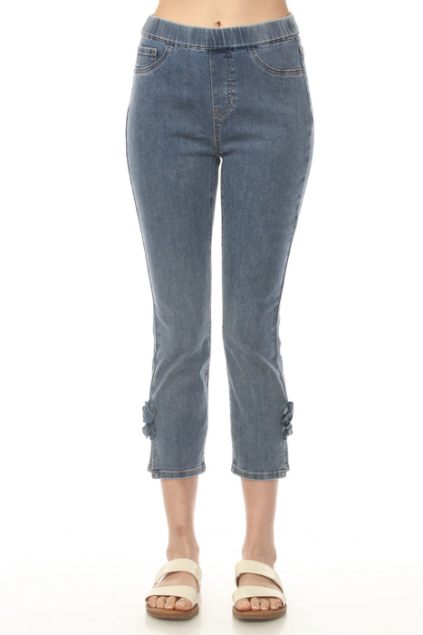 Woman wearing a slim cropped jeans with pull on waist and side slit with rose detail from Charlie B
