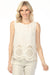 Woman wearing a sleeveless cream top with eyelet embroidered scallopedhem details from Charlie B