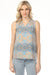 Woman wearing a sleeveless patterned top with v-neck and ruffled collar from Charlie B