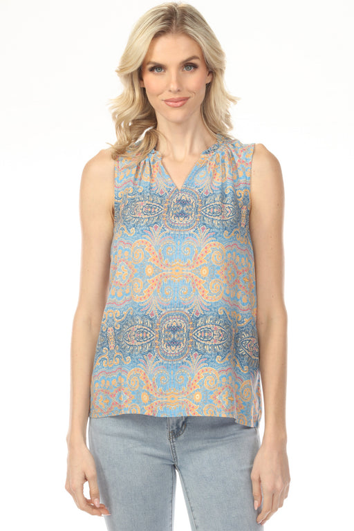 Woman wearing a sleeveless patterned top with v-neck and ruffled collar from Charlie B