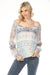 Woman wearing a lightweight Fair Isle patterned raglan sleeve blouse from Charlie B
