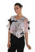 Woman wearing a black top with floral chiffon overlay and bow detail from Frank Lyman
