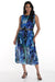 Woman wearing a blue floral abstract patterned pleated chiffon dress with belt from Frank Lyman
