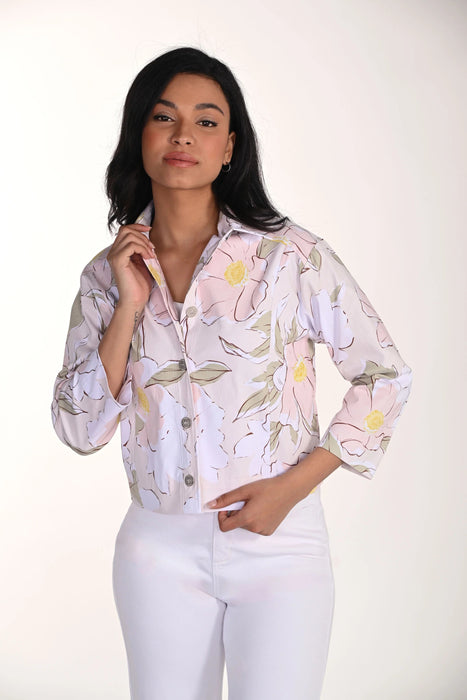 Woman wearing a floral blouse with a white background