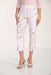 Woman wearing floral pants on a white background