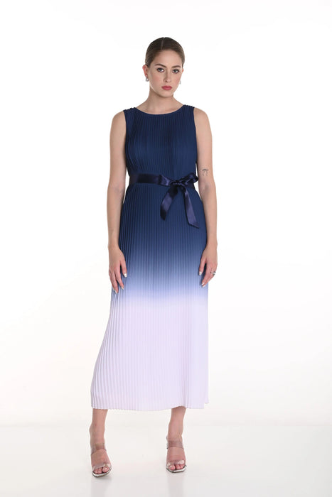 Woman wearing a blue and off-white gradient pleated long dress with satin waist ribbon from Frank Lyman