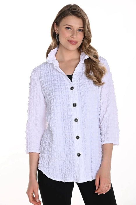 Woman wearing a white textured blouse with 3/4 sleeves and button front from Frank Lyman