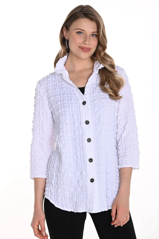 Woman wearing a white textured blouse with 3/4 sleeves and button front from Frank Lyman