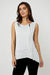 Woman wearing an off-white textured sleeveless top with zipper detail from Frank Lyman