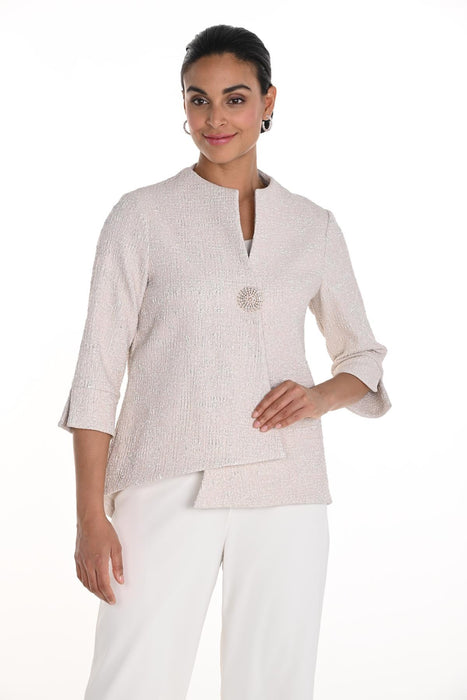 Woman wearing a light pink shimmery textured jacket with swing flared hem from Frank Lyman