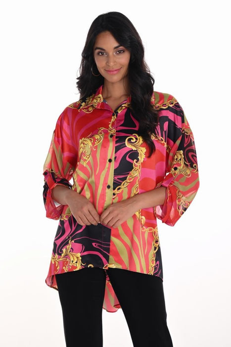 Woman wearing a colorful patterned blouse with 3/4 sleeves and high low hem from Frank Lyman