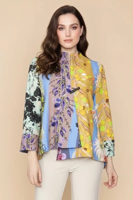Woman wearing a colorful floral-patterned jacket with split neck and one button closure from IC Collection