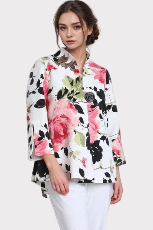 Woman wearing a white floral jacket with back pleats from IC Collection