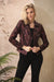 Woman wearing the Insight New York Liquid Wine Clouds Moto Jacket with a metallic wine finish, textured faux leather, cropped hourglass silhouette, and silver hardware.