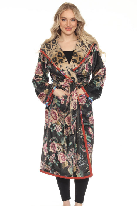 Woman wearing a plush sleep robe, reversible with floral and animal print