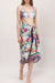Woman wearing a colorful sarong with self-tie waist and colorful florals and stripes from Johnny Was