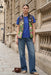 Woman wearing a tropical printed puffer vest with zip up front and pockets from Johnny Was
