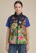 Woman wearing a tropical printed puffer vest with zip up front and pockets from Johnny Was