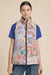 Woman wearing a paisley floral printed puffer vest with zip up front and pockets from Johnny Was