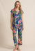 Woman wearing a matching blue floral sleepwear including a short sleeve top and crop pajama pants from Johnny Was