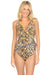 Woman wearing a wrap one piece swimsuit with animal pattern and v-neck from Johnny Was