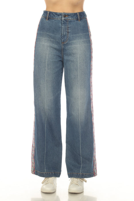 Model wearing a blue wide leg denim jean with side tape from Johnny Was