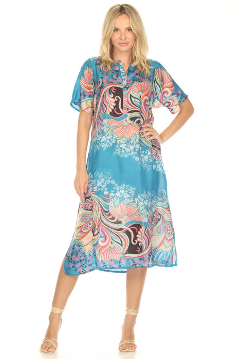 Woman wearing a colorful midi dress with a paisley pattern and henley neckline from Johnny Was