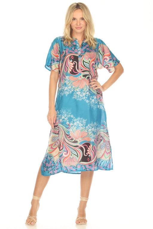 Woman wearing a colorful midi dress with a paisley pattern and henley neckline from Johnny Was