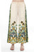 Woman wearing a cream-colored wide leg pants with floral print and drawstring waistband from Johnny Was