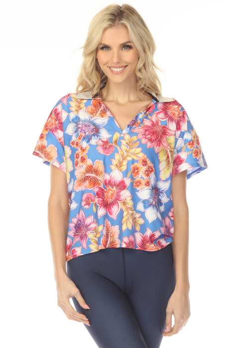 Woman wearing a colorful floral t-shirt with collared v-neck and short sleeves from Johnny Was