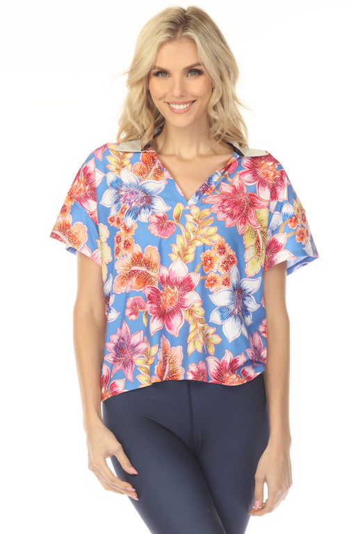 Woman wearing a colorful floral t-shirt with collared v-neck and short sleeves from Johnny Was