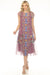 Woman wearing a light purple mesh embroidered midi dress with boat neck and flutter sleeves from Johnny Was