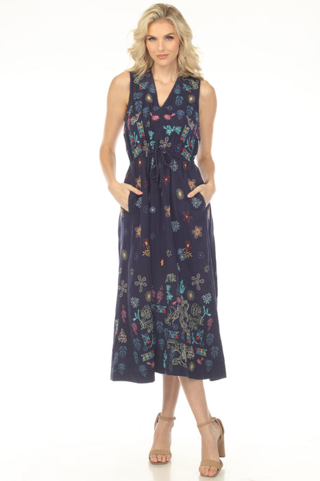 Woman wearing a blue embroidered A-line dress with v-neck, sleeveless, and drawstring waist from Johnny Was